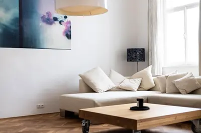 a living room with a couch and a coffee table at Bright stylish central apartments Prague in Prague