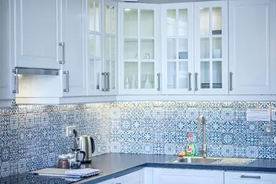 a kitchen with white cabinets and a sink at ✰DOWNTOWN GRAND APARTMENT - Old Town TOP Location✰ in Prague
