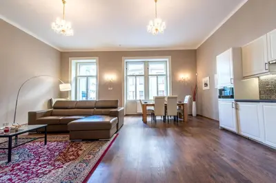 a living room with a couch and a table at ✰DOWNTOWN GRAND APARTMENT - Old Town TOP Location✰ in Prague