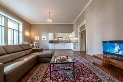 a living room with a couch and a tv at ✰DOWNTOWN GRAND APARTMENT - Old Town TOP Location✰ in Prague