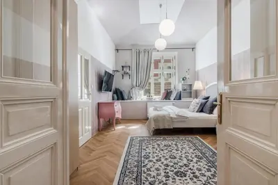 a hallway with a door and a living room at City centre Apartment Prague by Michal&Friends in Prague