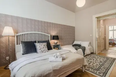 a bedroom with two beds with towels on them at City centre Apartment Prague by Michal&Friends in Prague