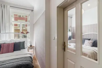 a bedroom with a bed and a mirror at City centre Apartment Prague by Michal&Friends in Prague