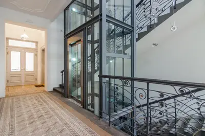 a staircase in a house with a glass wall at Prague Trendy Central Apartment by Michal&Friends in Prague