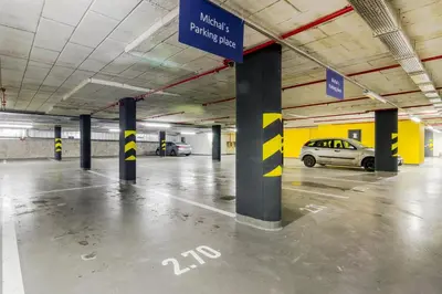 an empty parking garage with cars parked in it at Prague Luxury Apartments Parking by Michal&Friends in Prague