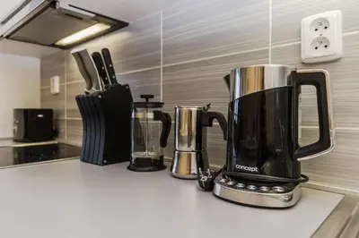 a kitchen counter with two kettles on a counter top at Luxury Center APT Garage Parking by Michal&Friends in Prague