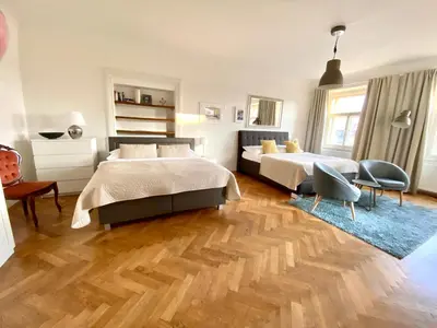 a view of a kitchen from the living room through a mirror at Prague Historic Center Apartments in Prague