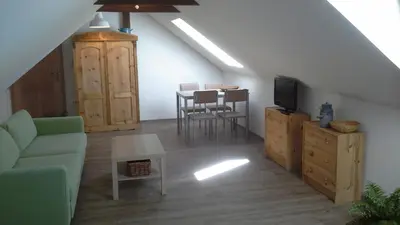 a living room with a couch a table and a tv at Písková Lhota 8 in Písková Lhota