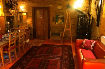 a living room with a couch and a table and chairs at Apartmány U kapličky in Kamýk nad Vltavou