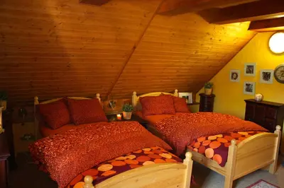 two twin beds in a room with a attic at Apartmány U kapličky in Kamýk nad Vltavou