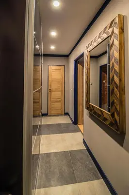 a hallway with a door and a tile floor at 3BDR RUTERRA Apt with Table Football in Prague