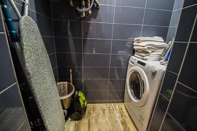 a bathroom with a washing machine in a room at 3BDR RUTERRA Apt with Table Football in Prague