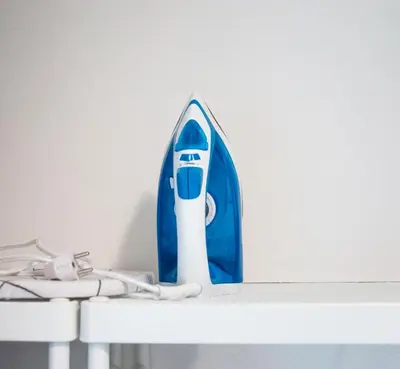 a blue and white hair dryer sitting on a shelf at Apartment U Pujcovny 6 in Prague
