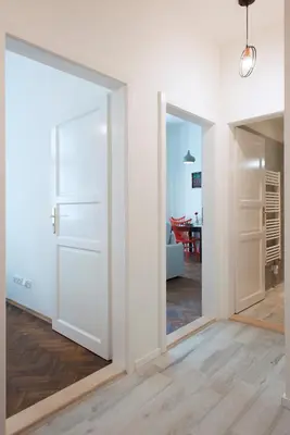 an open door in a room with a living room at Kent Ridge Loft (Lublanska) in Prague