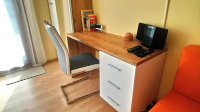 a desk with a television on top of it at Lovely apartment, Garden, Parking, Wifi, Netflix in Prague