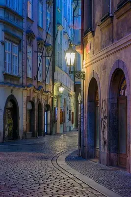 an empty street in a city at night at Karlova 25 Apartments in Prague
