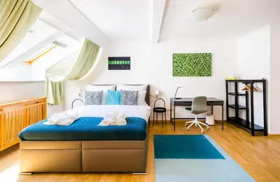 a bedroom with a bed and a desk at HOME ALONE 5BR+3BATH Penthouse in center of Prague in Prague