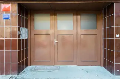 a pair of wooden doors on a building at Prague city centre apartment Radka1 in Prague