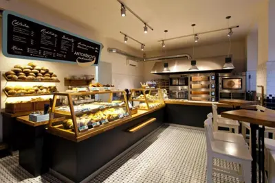 a bakery with a counter with a lot of pastries at Prague city centre apartment Radka1 in Prague