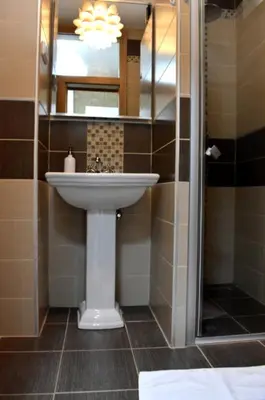a bathroom with a sink and a mirror at Prague city centre apartment Radka1 in Prague