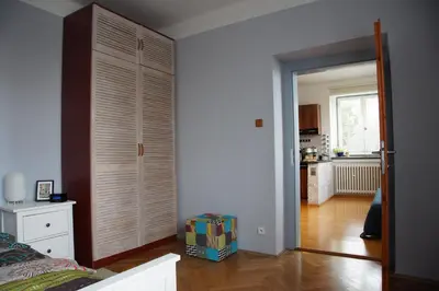 a room with a door open to a room with a kitchen at APARTMÁN V ZAHRADĚ PRAHA TROJA - APARTMENT IN THE GARDEN PRAGUE Troja in Prague