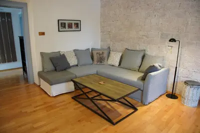 a living room with a couch and a coffee table at APARTMÁN V ZAHRADĚ PRAHA TROJA - APARTMENT IN THE GARDEN PRAGUE Troja in Prague