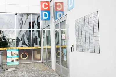 a door to a donut shop with a sign on it at Balu Apartments in Prague