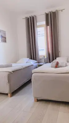 a room with two beds and a window in it at Apartment Happy 11 in Prague