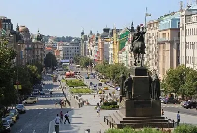 a statue of a man on a horse on a city street at Apartment Happy 11 in Prague