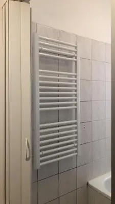 a glass shower door in a bathroom with a sink at Apartment Happy 11 in Prague