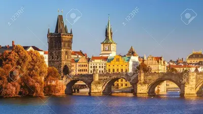 a bridge over a river with a city in the background at Apartment Happy 11 in Prague