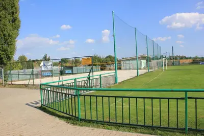 a batting cage on a tennis court in a field at Apartments Severka in Prague