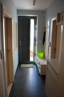 a hallway with a door leading to a bathroom at Apartments Severka in Prague