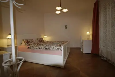 a bedroom with a bed and two night stands at Apartment No 0A Anenska 13 - Stare Mesto in Prague