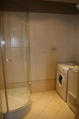 a bathroom with a washing machine and a washer at Apartment No 0A Anenska 13 - Stare Mesto in Prague