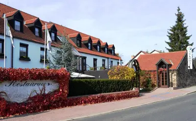 a row of houses on the side of a street at Park Hotel Pruhonice in Pruhonice