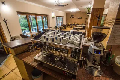 a kitchen with a mixer and a counter with a machine at Hotel Sport in Štětí