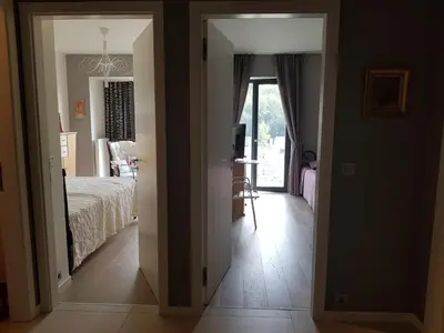 a view of a bedroom with a bed and a table at Praha Karibik in Prague