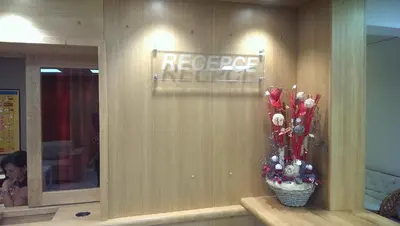 a store front with a recycle sign on a wall at Hotel Terek in Štětí