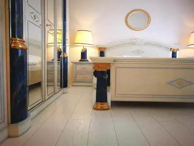 a hotel room with a desk and a bed at Hotel Union in Louny