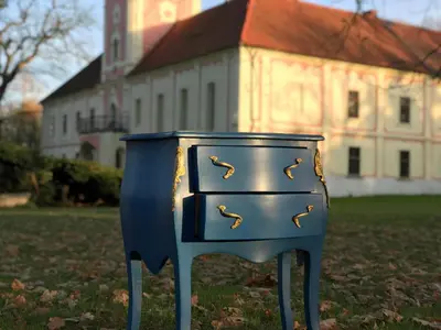 a blue dresser in front of a building at Penzion Zámek Lešany in Netvořice