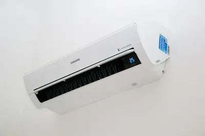 a white laser printer on a white background at Sunny Aircon Apartment in the Centre of Slaný in Slaný