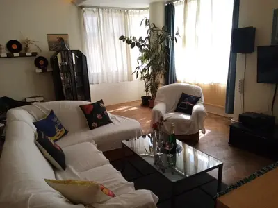 a living room with two white couches and a coffee table at Apartmány Rossa in Louny
