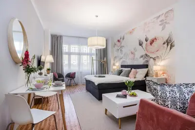 a living room with a bed and a couch at APT in Prague Charles Bridge 1km by Michal&Friends in Prague