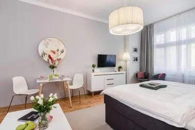 a hotel room with a bed and a table and chairs at APT in Prague Charles Bridge 1km by Michal&Friends in Prague