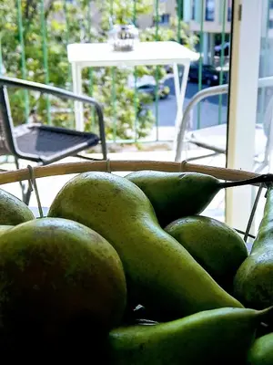 a pile of green fruit sitting on top of a table at Apartment Archa Poděbrady in Poděbrady