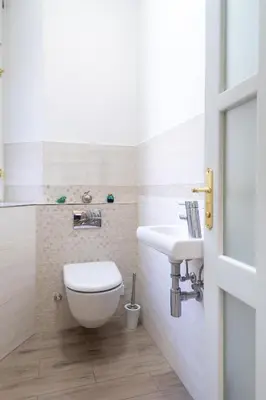 a bathroom with a toilet and a sink at Quiet apartment in the heart of Old Town centre in Prague
