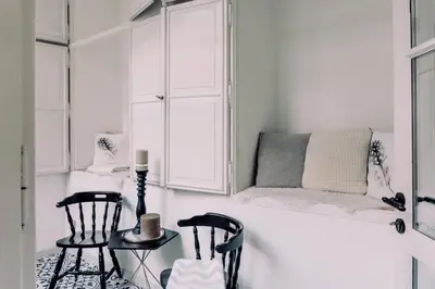 a white room with two chairs and a table at Wenceslas Square / Main Station - NEW STUDIO***** in Prague