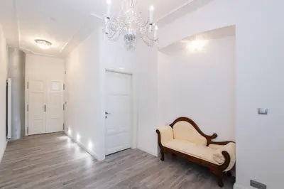 a living room with a bench and a chandelier at Wenceslas Square / Main Station - NEW STUDIO***** in Prague