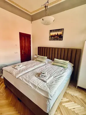a bedroom with a large bed in a room at Historic Centre Apartments VIII in Prague